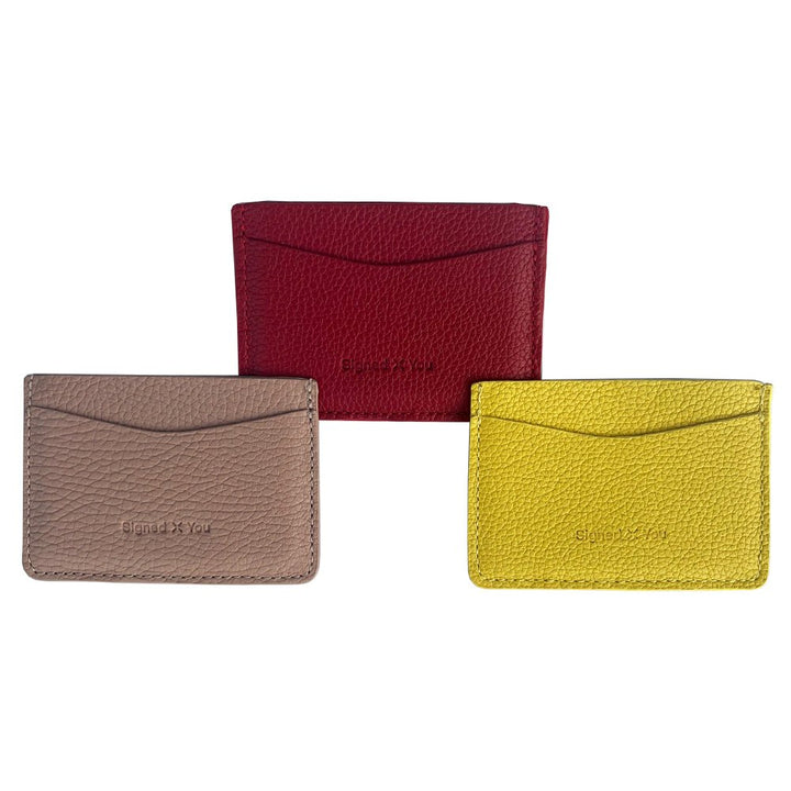 Set of card holders in rose, yellow and red saved leather. Compact, stylish, and finished with the unique Signed By You logo.